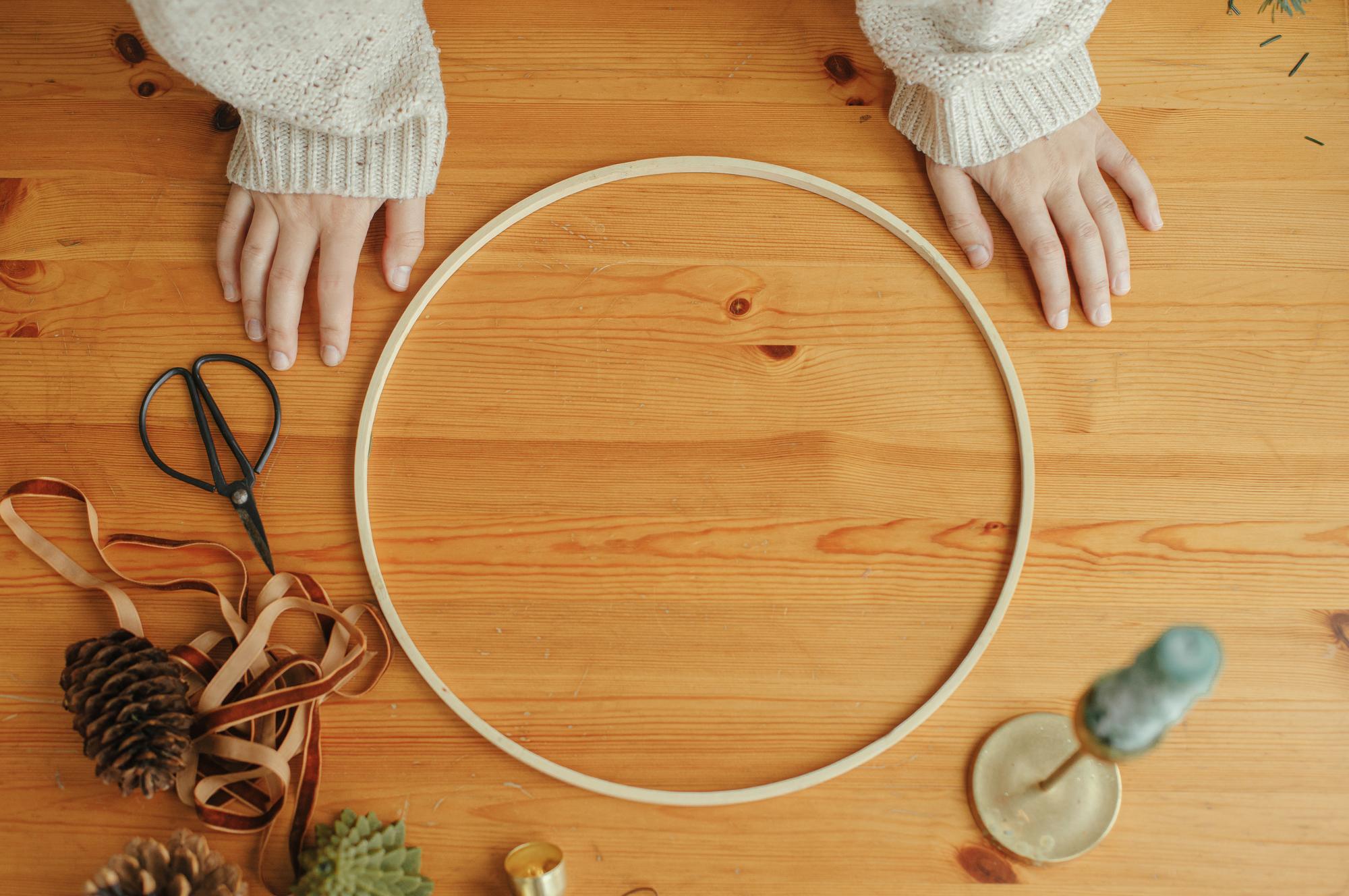 Workshop table with embroidery hoop and lamp