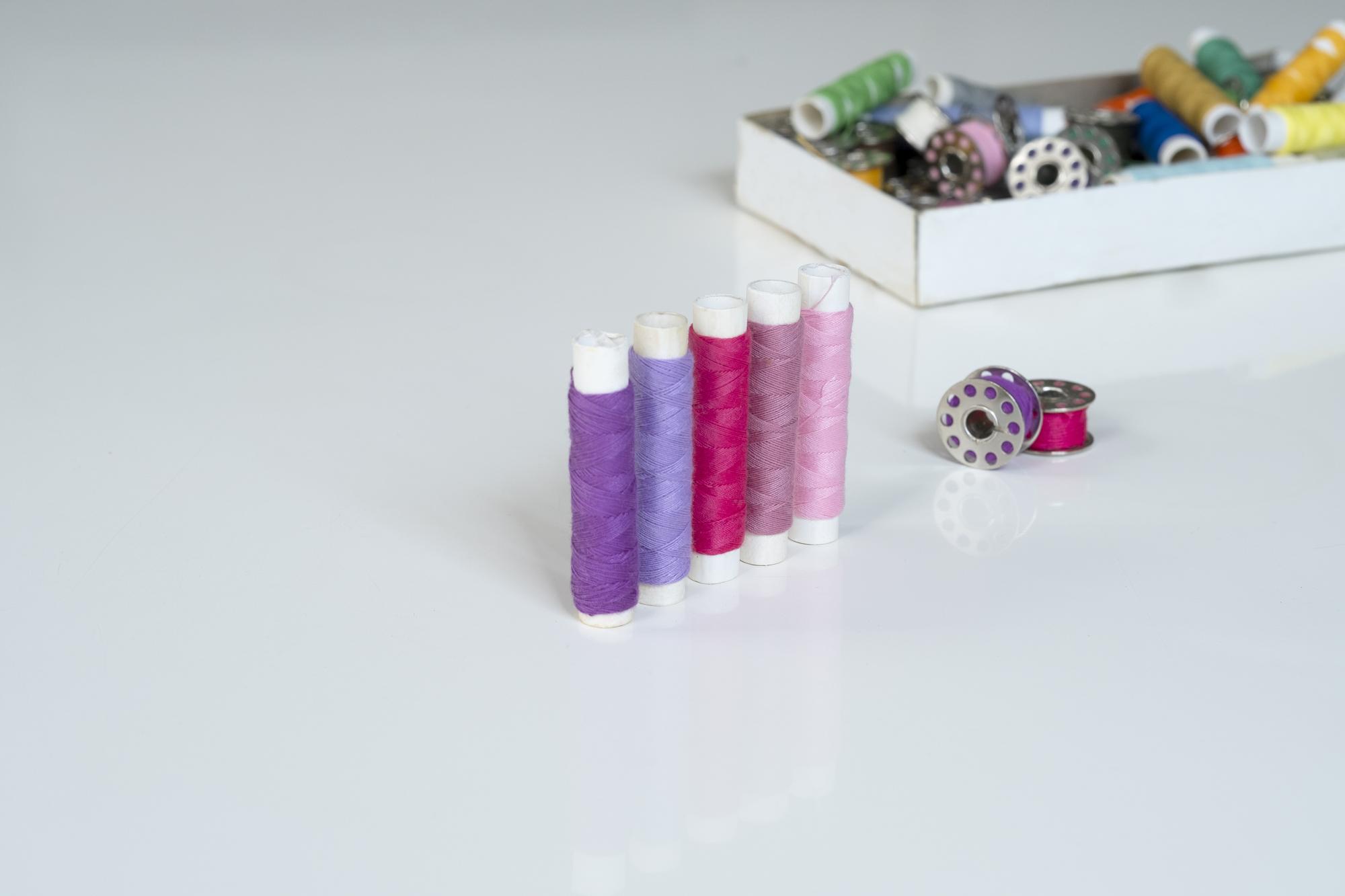 Three sample embroidered products on table